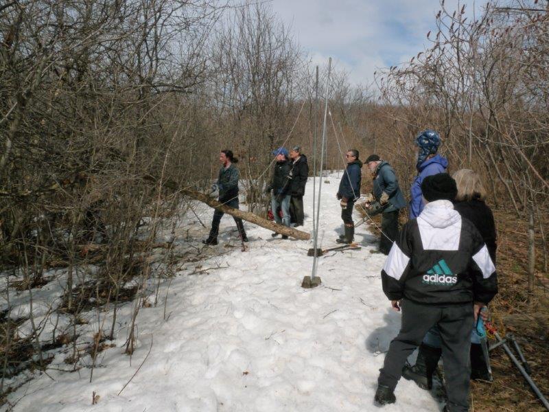 Volunteers helping with habitat management on a partly sunny but still snowbound day early this week (Photo by Marcel Gahbauer)